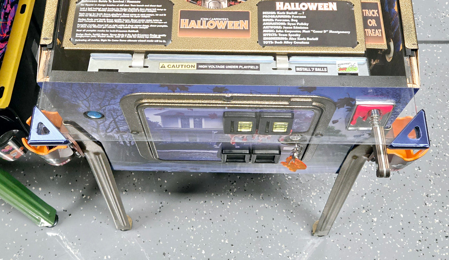 Flexible pinball glass edge guards for safe removal and service
